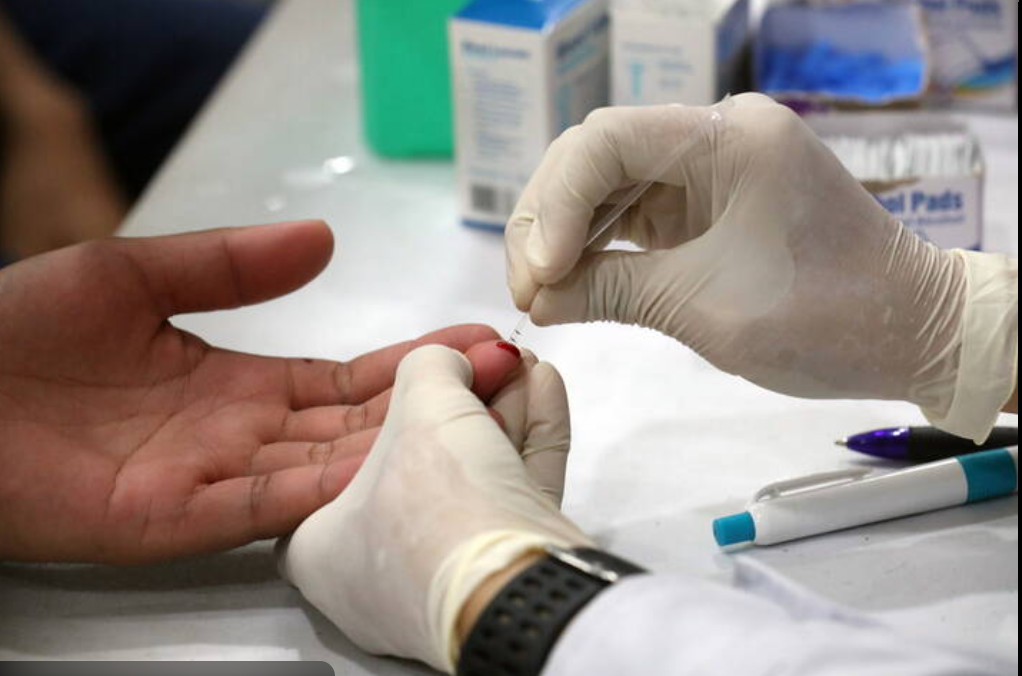 Clinical laboratory professional performing rapid test kit analysis in a certified medical environment